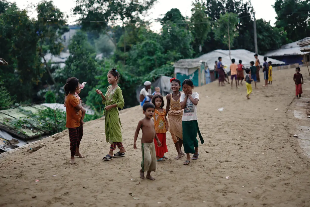 Rohingya refugee children roam on a road at the Kutupalong refugee camp in Cox's Bazar