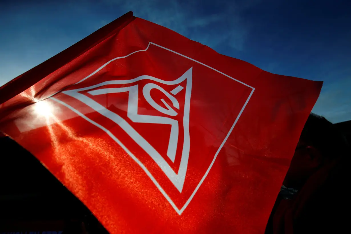 Members of German Metal Workers' Union IG Metall protest in front of a Siemens factory in Karlsruhe