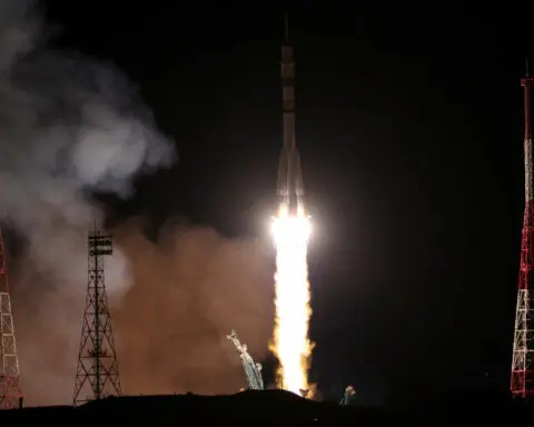 Spacecraft carrying Russians and American docks with International Space Station
