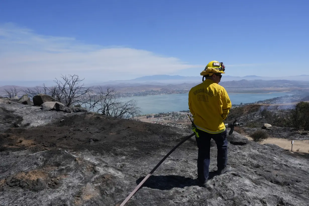 Wildfires in Southern California torch dozens of homes and force thousands to evacuate