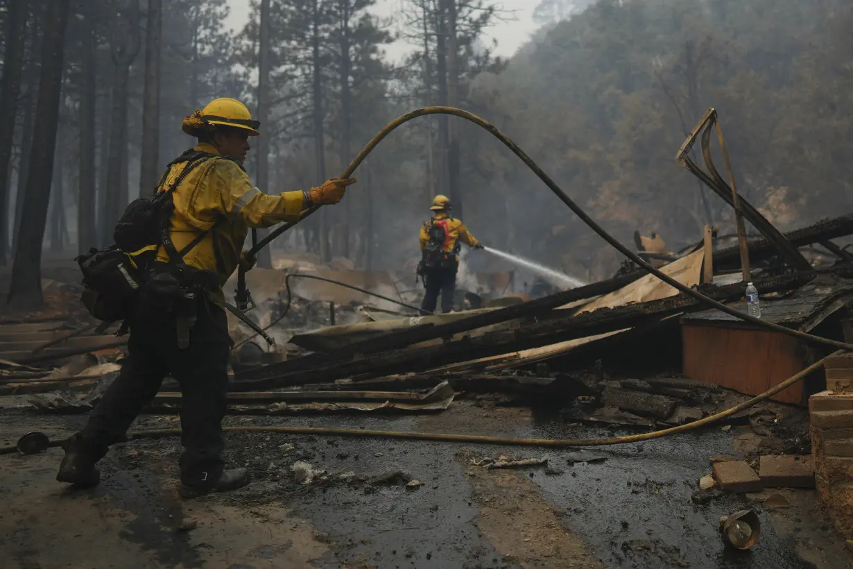 Wildfires in Southern California torch dozens of homes and force thousands to evacuate