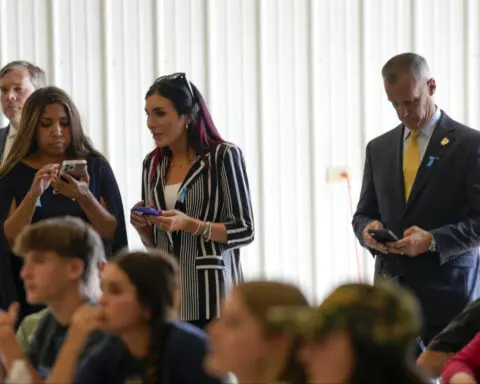 Laura Loomer, who promoted a 9/11 conspiracy theory, joins Trump for ceremonies marking the attacks