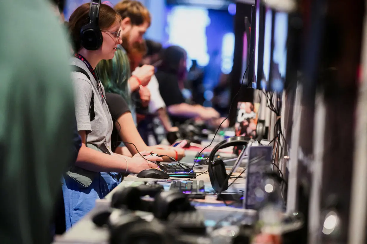 FILE PHOTO: Visitors attend the 2024 Gamescom computer and video game industry event in Cologne