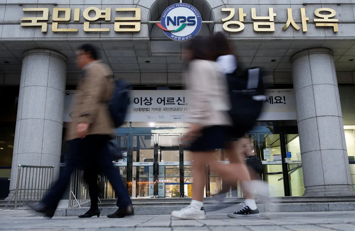 People walk past a branch office of the National Pension Service (NPS) in Seoul