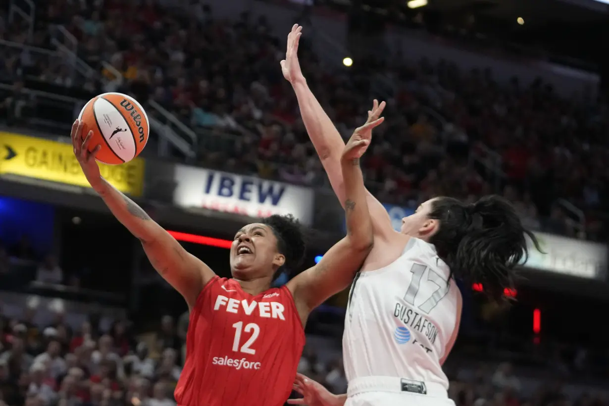 A’ja Wilson becomes the WNBA’s single-season scoring leader, Aces beat Fever for 14th straight time