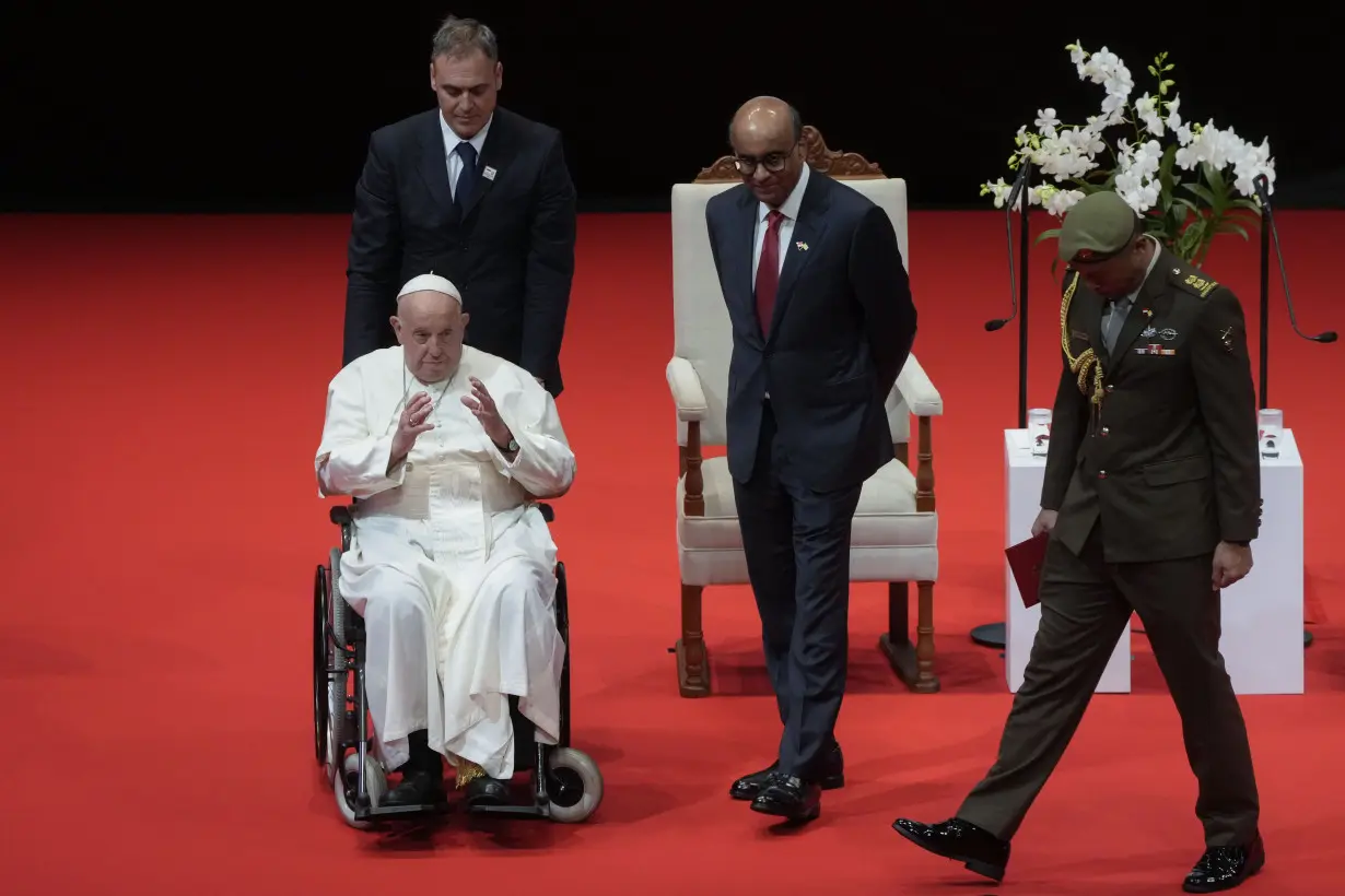 Pope marvels at Singapore's skyscrapers and asks that the lowest migrant workers not be forgotten