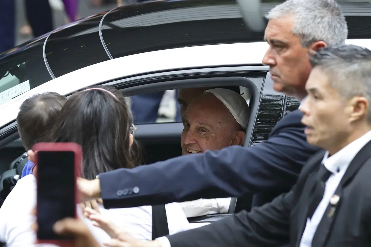 Pope marvels at Singapore's skyscrapers and asks that the lowest migrant workers not be forgotten