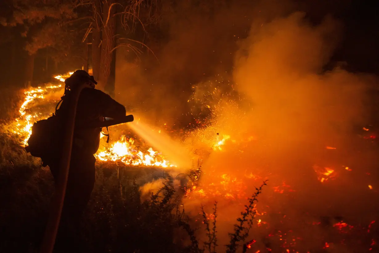 Cal Fire firefighters tackle the Bridge Fire threatening mountain communities, in Wrightwood