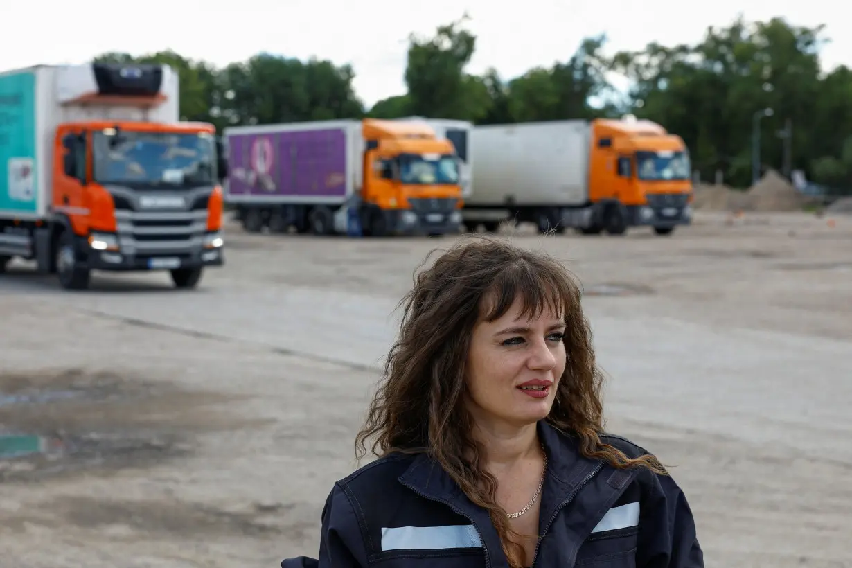 Truck driver Liliia Shulha speack during an interview with Reuters in Kyiv region