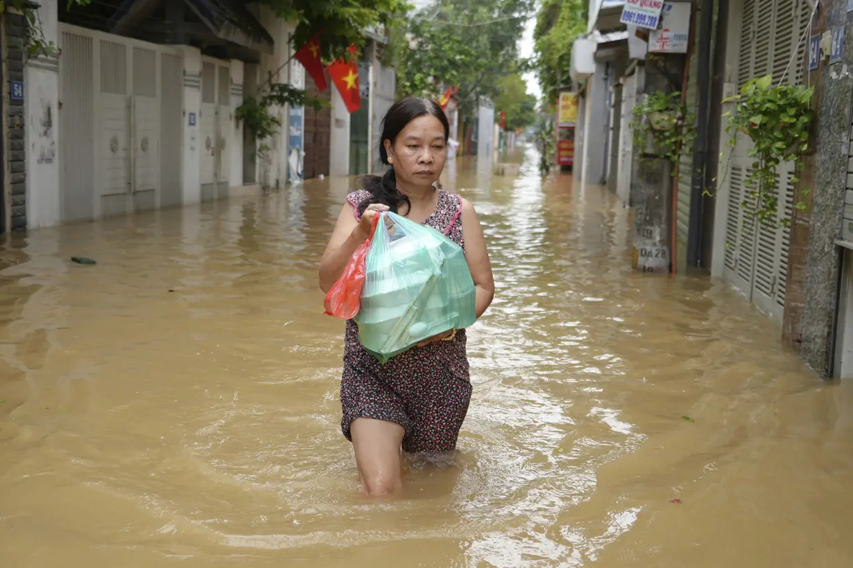 Death toll climbs to 199 in Vietnam as typhoon's aftermath brings flash floods and landslides