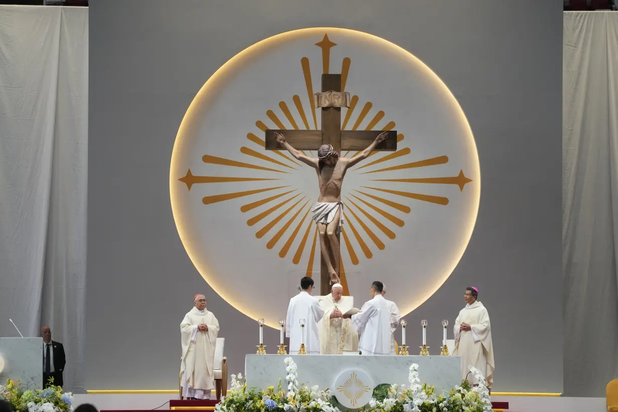 Pope marvels at Singapore's skyscrapers and asks that the lowest migrant workers not be forgotten