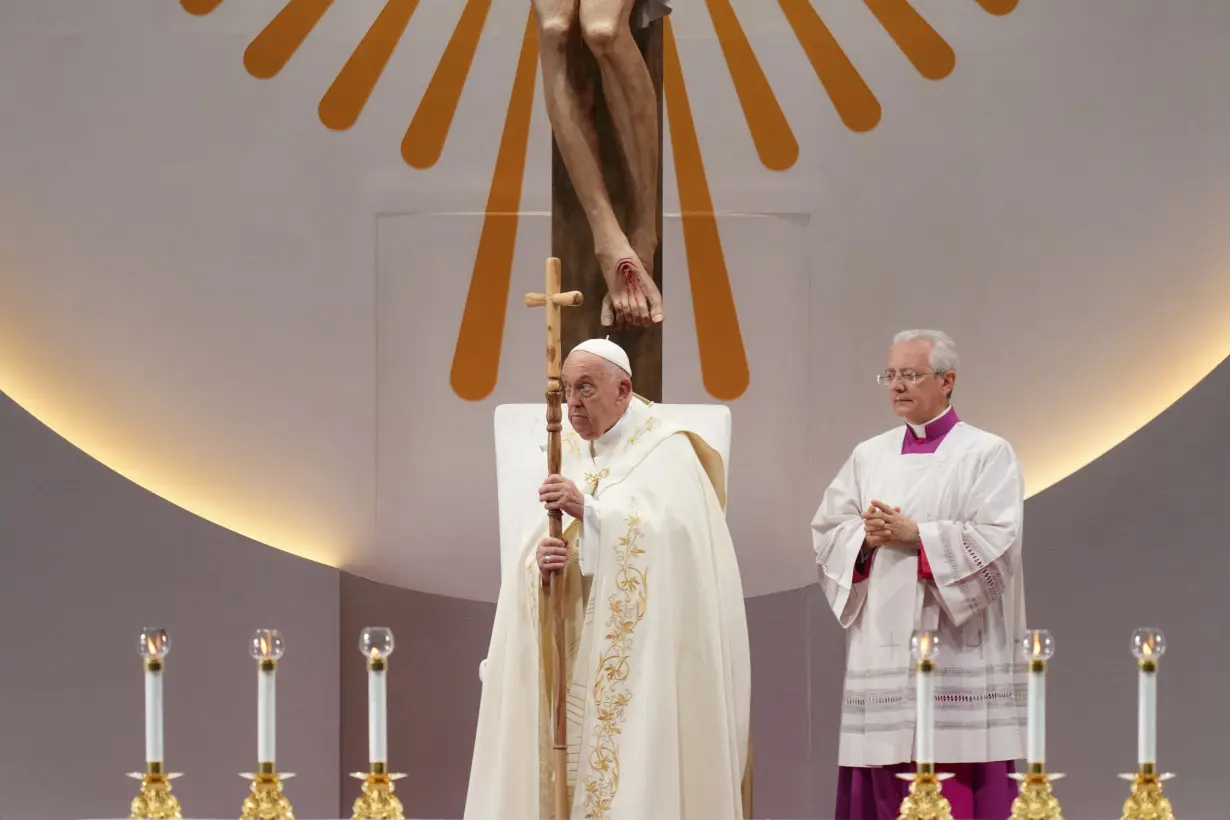 Pope marvels at Singapore's skyscrapers and asks that the lowest migrant workers not be forgotten