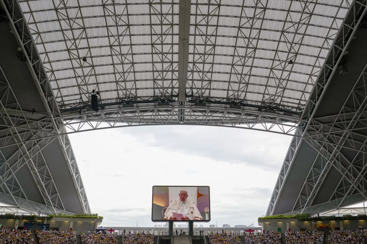 Pope marvels at Singapore's skyscrapers and asks that the lowest migrant workers not be forgotten