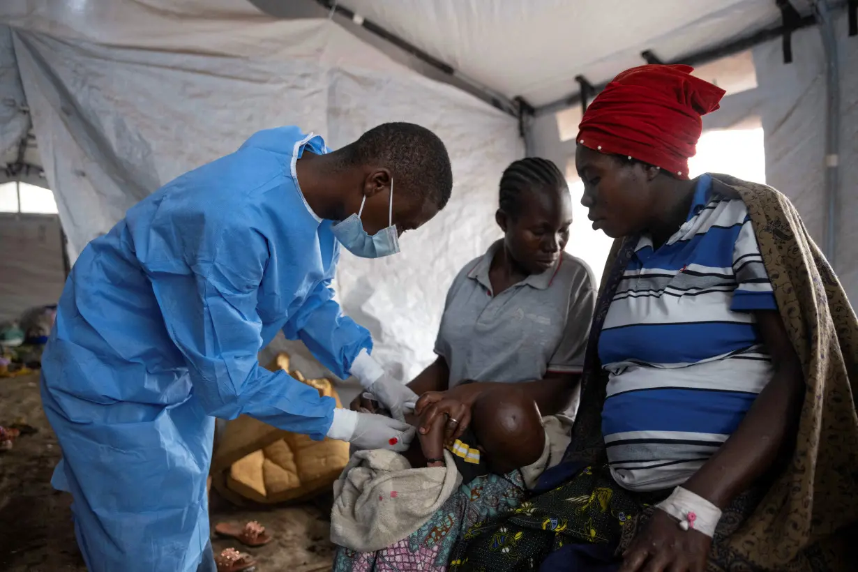 FILE PHOTO: A Congolese nurse takes a sample from a suspected mpox patient in the treatment centre at the Kavumu hospital in Kabare territory