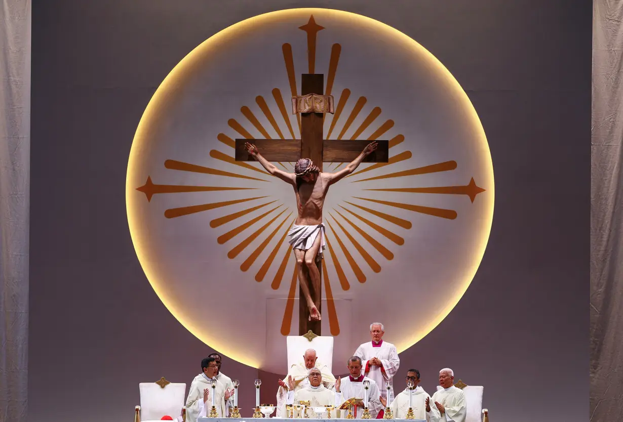 Pope Francis presides a Mass with devotees at the National Stadium in Singapore