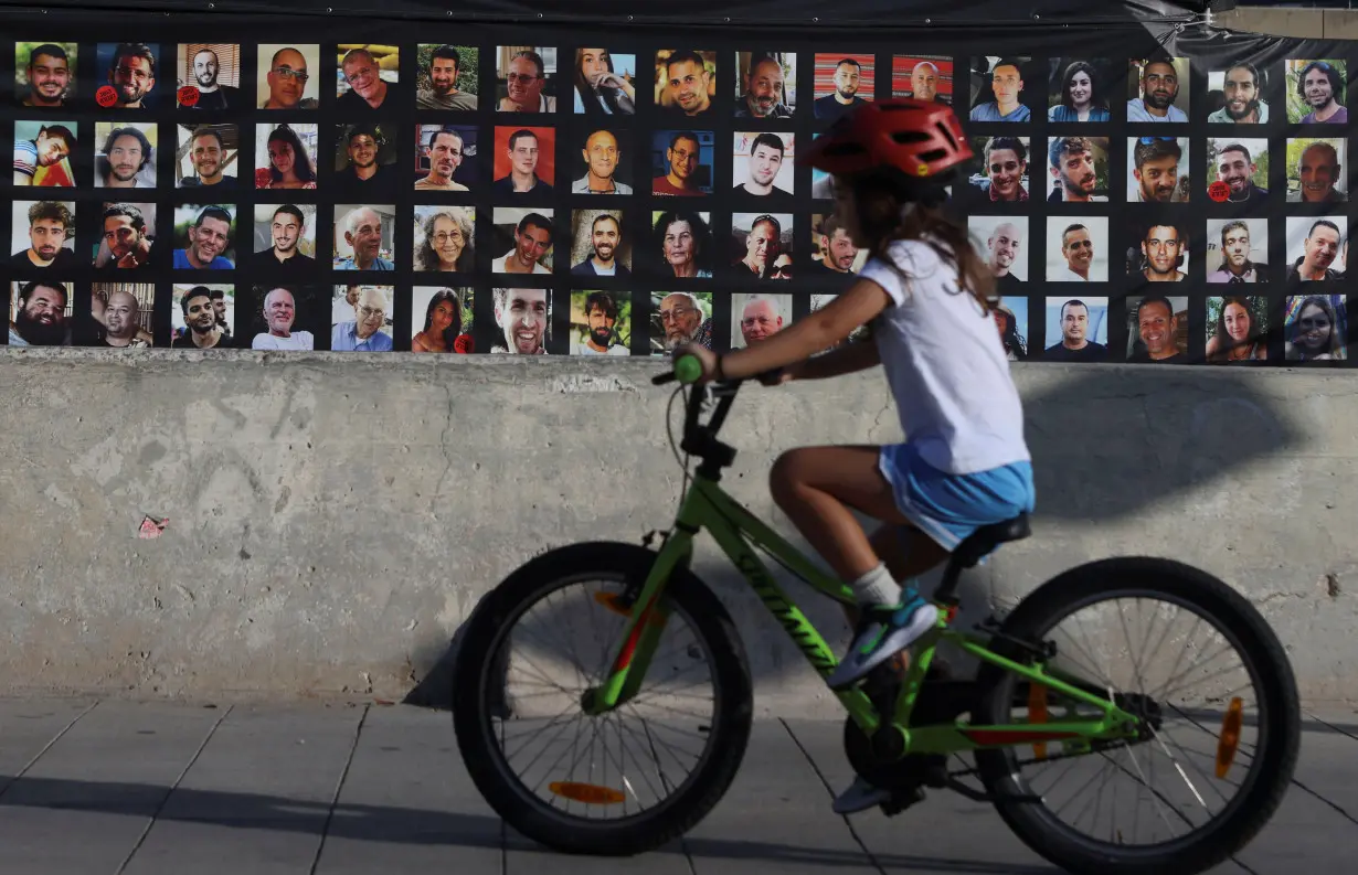 Images of those taken hostage or killed during the deadly October 7 attack are displayed, Tel Aviv