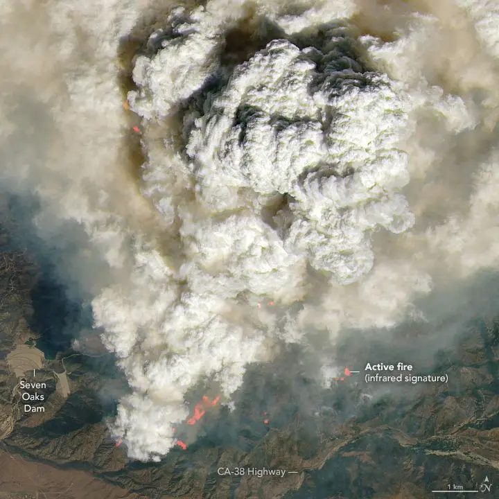 Satellite imagery captures the Line Fire's pyrocumulus clouds on Monday, September 9. Pink-ish and orange areas highlight active fire hot spots.