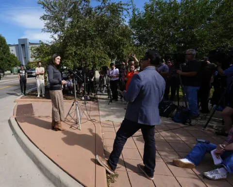 Woman held hostage dies and the suspect is arrested after an hourslong standoff near Denver