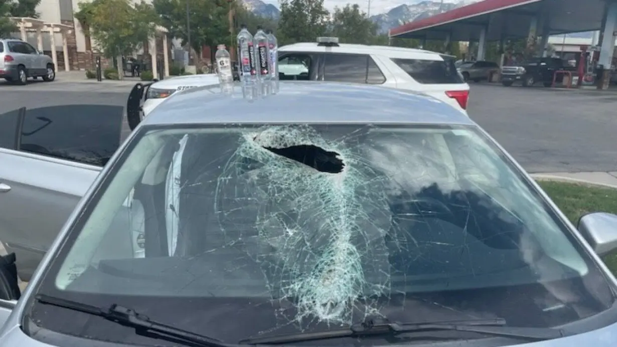 Close call as metal flies through Utah driver's windshield