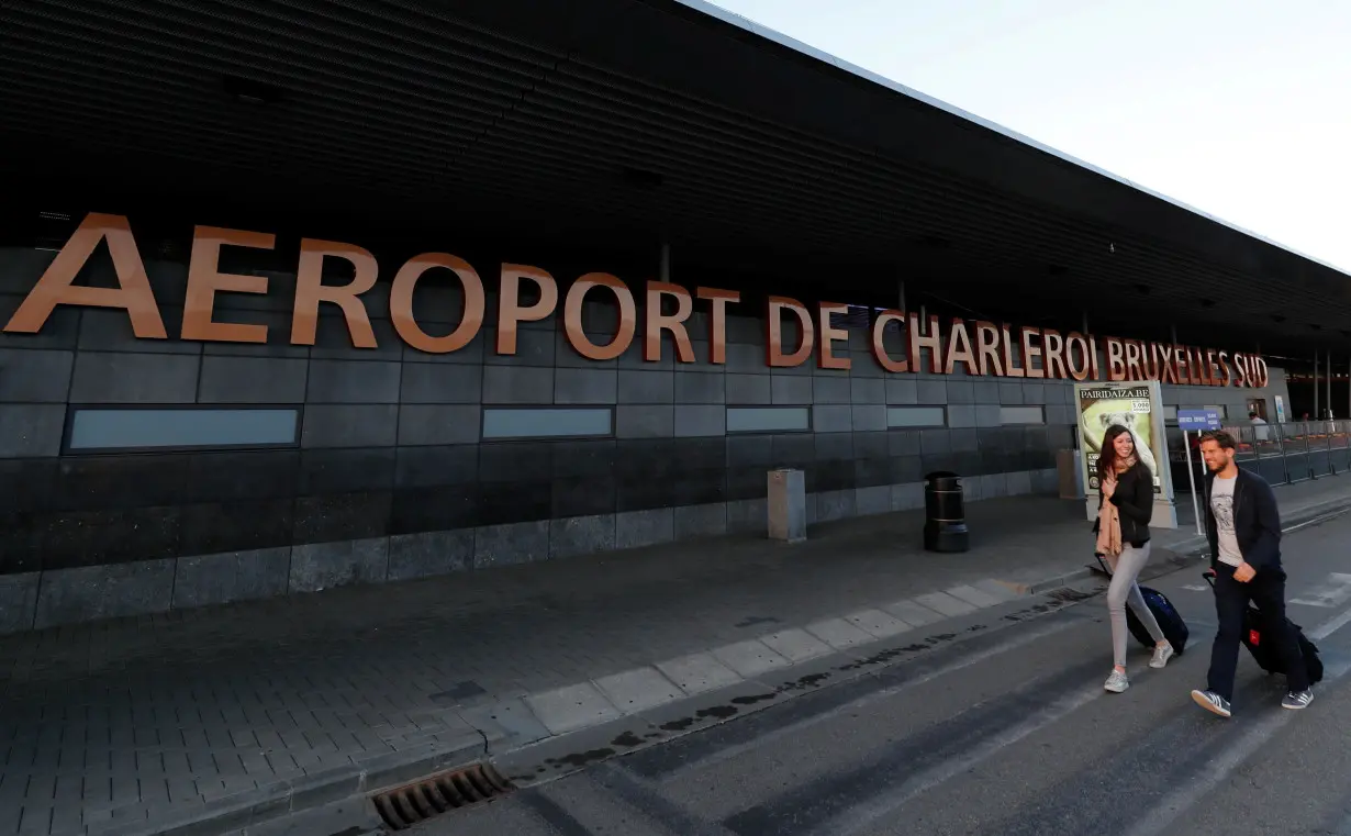 Passengers arrive at Brussels South Charleroi Airport during a Ryanair wider European strike