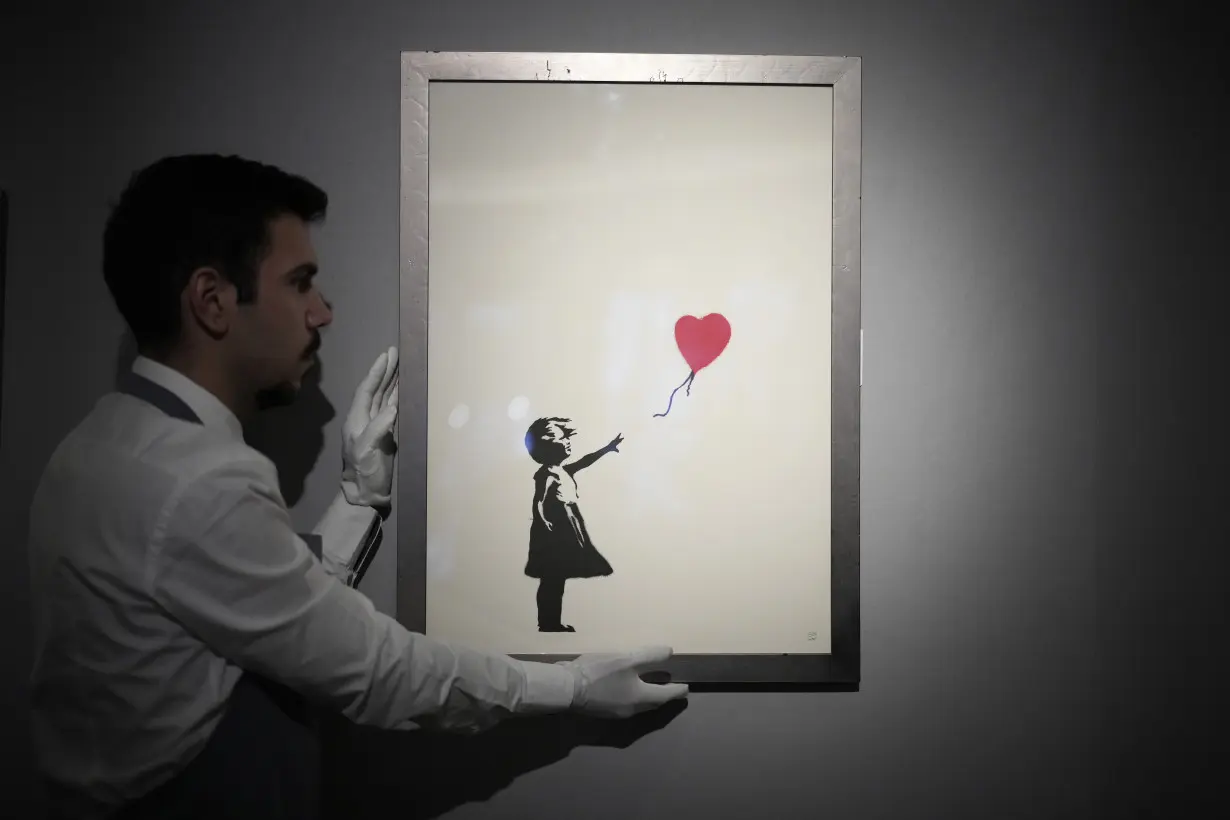 2 men are charged with stealing a famous Banksy artwork from a London gallery