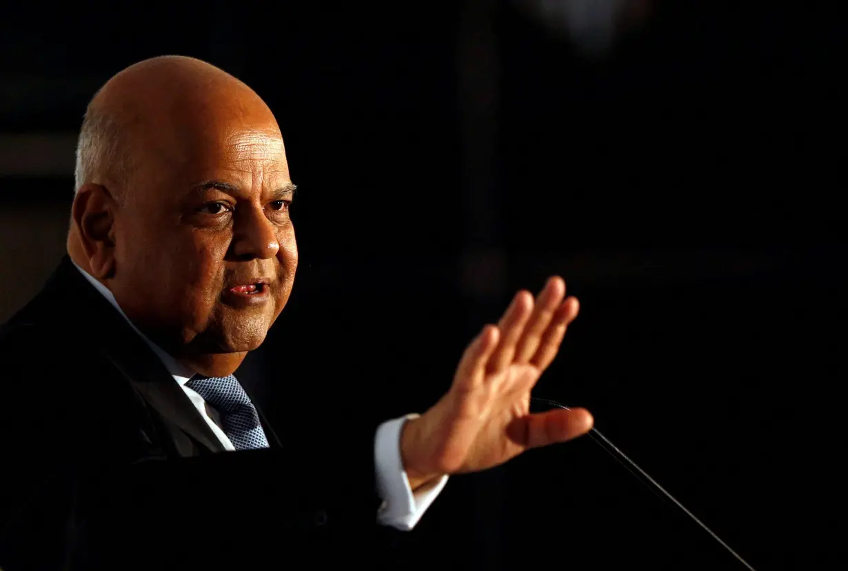 FILE PHOTO: Former Finance Minister Pravin Gordhan gestures during a business summit in Sandton