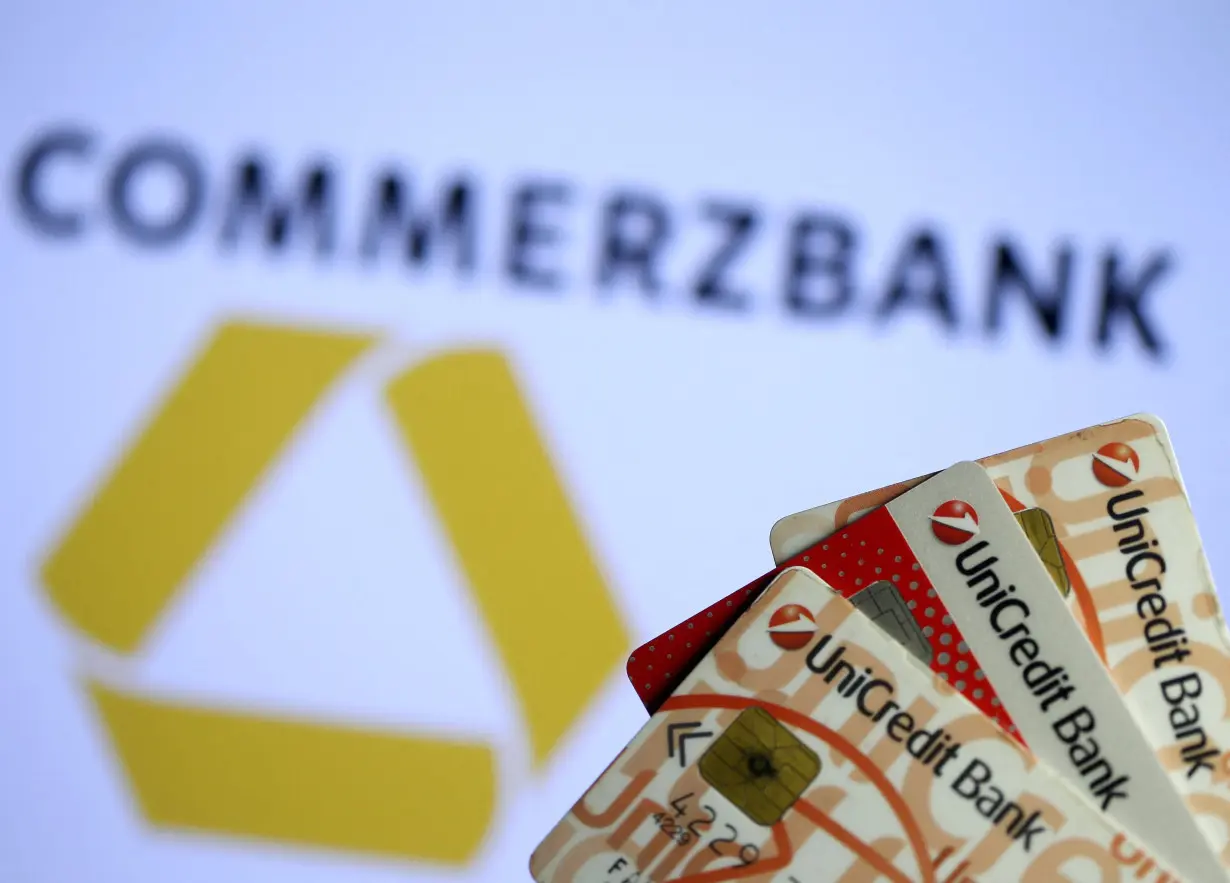 FILE PHOTO: Unicredit credit cards are seen in front of displayed Commerzbank logo in this illustration taken