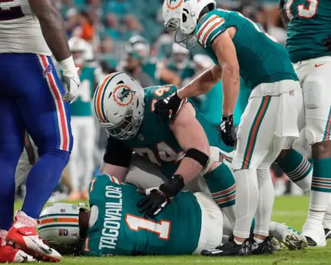 Dolphins quarterback Tua Tagovailoa suffers concussion after collision with Damar Hamlin in loss to Bills