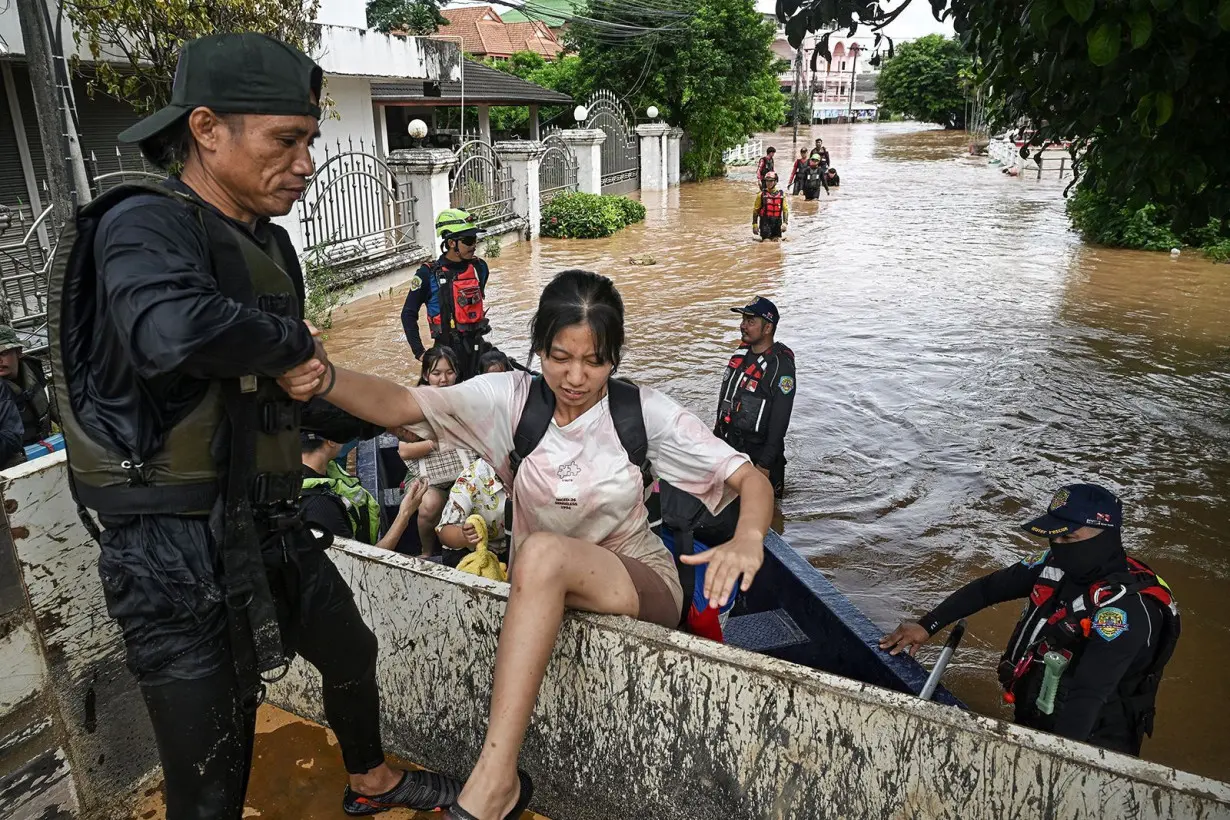 Rescue teams pick up schoolchildren and residents in Chiang Rai, Thailand on Thursday, September 12.