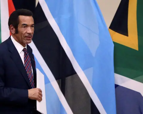 Botswana's exiled ex-leader Khama returns home, court suspends warrants