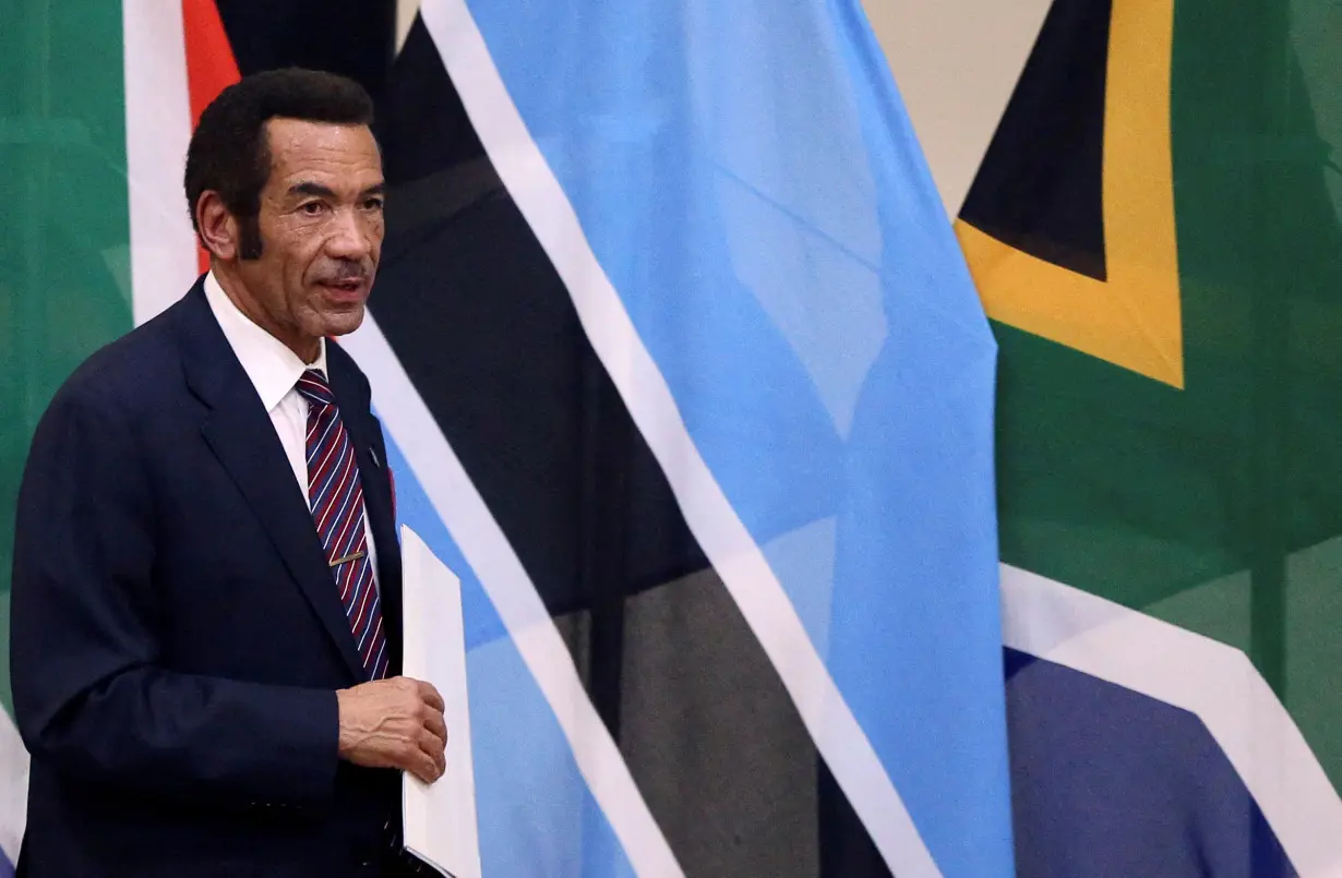 FILE PHOTO: Botswana's President Ian Khama returns to his seat after giving a speech during the Botswana-South Africa Bi-National Commission (BNC) in Pretoria