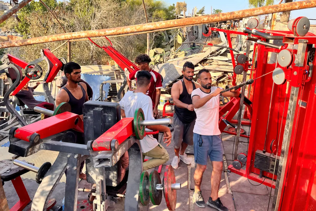 In gym salvaged from rubble, Gazans release anger on weight machines