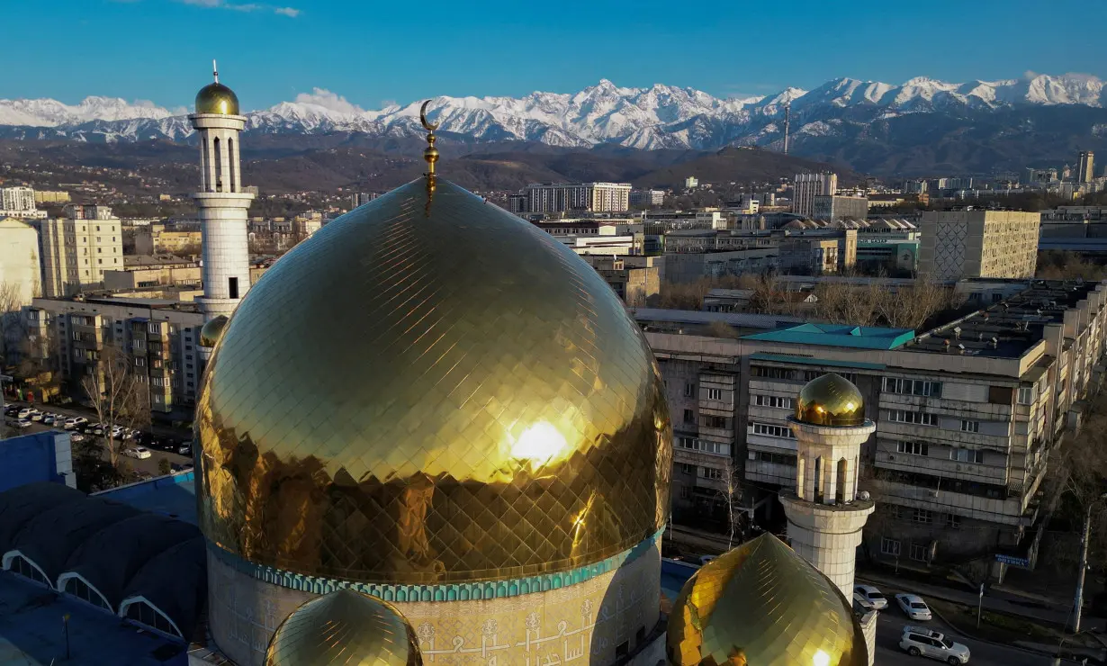 FILE PHOTO: A drone view shows domes of the Central Mosque with the backdrop of the Tien Shan Mountains in Almaty