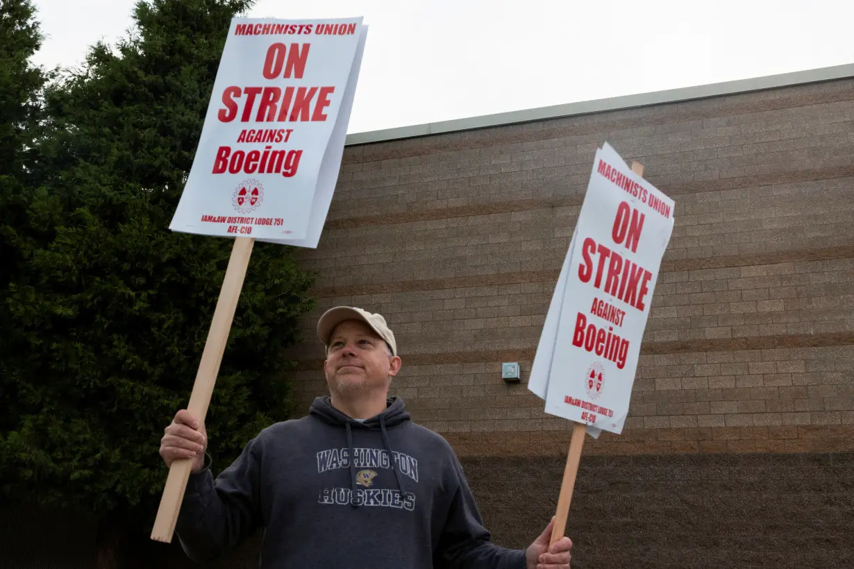 Boeing factory workers gather on picket lines in Washington state on first day of strike