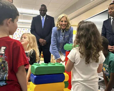 Jill Biden and Lloyd Austin visit an Alabama base to tout expanded military benefits