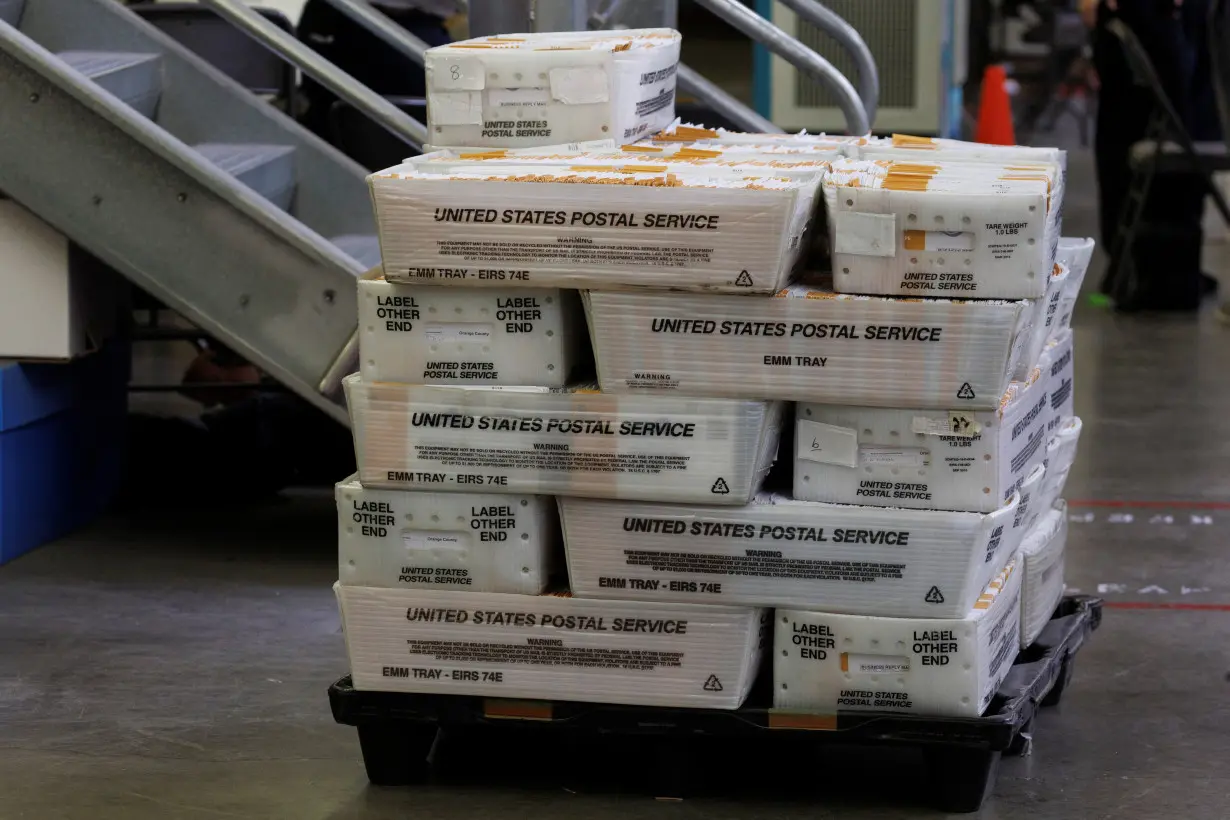 Election ballots are processed under tight security at the Orange County Registrar of Voters, in Santa Ana, Calfornia .