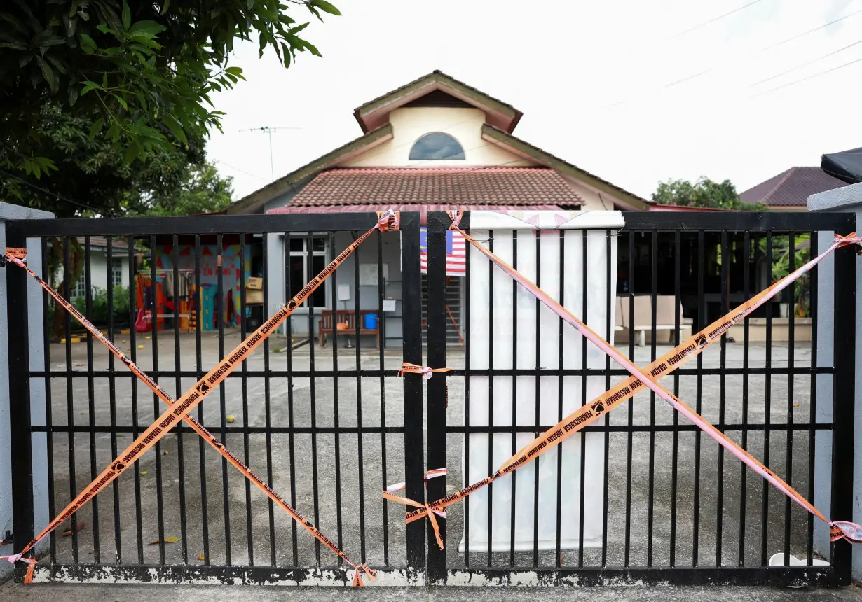 A view of a premise entrance sealed by the Malaysian Department of Social Welfare following a raid, in Subang