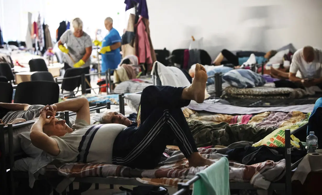 War-displaced people spend time in a centre for displaced people in undisclosed location in Kursk region on August 29, following Ukraine's cross-border offensive into Russia's western Kursk region.