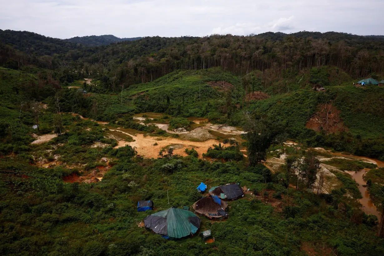 A Yanomami indigenous village is seen near a deactivated illegal mining site, in Yanomami indigenous land