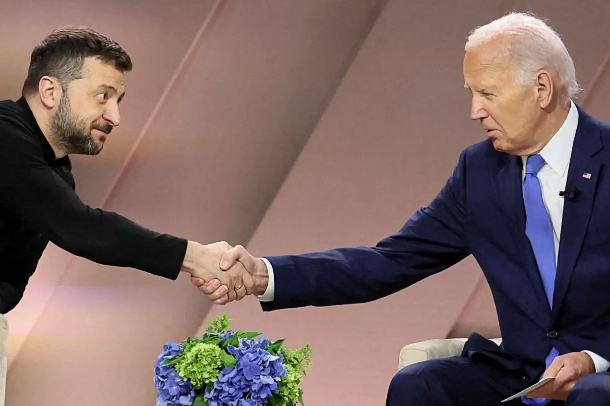 FILE PHOTO: Ukraine's Zelenskiy and US President Biden are shown in Washington