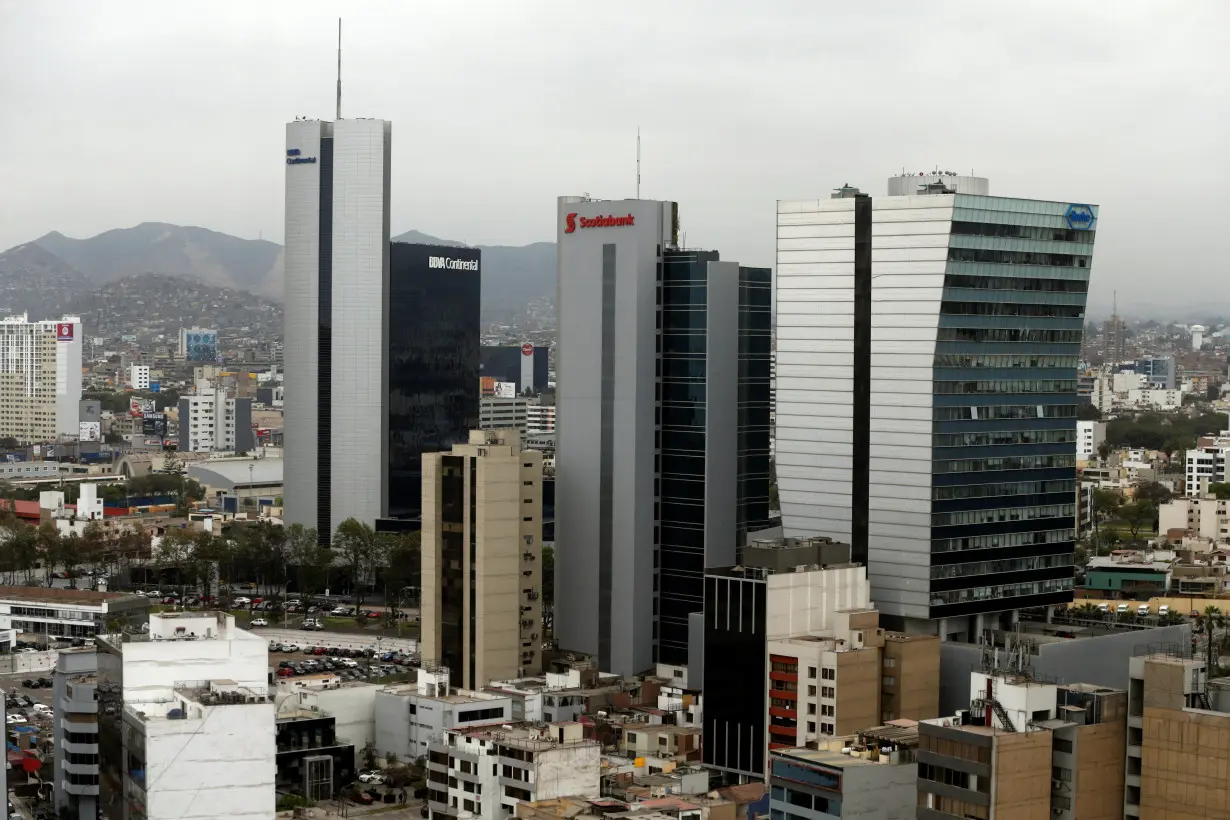 A general View shows San Isidro financial district through a window, in Lima