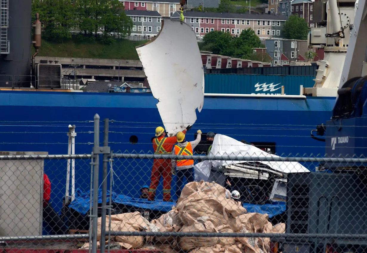 Debris from the Titan submersible, recovered from the ocean floor near the wreck of the Titanic, is unloaded at the Canadian Coast Guard pier in St. John's, Newfoundland, on June 28, 2023.