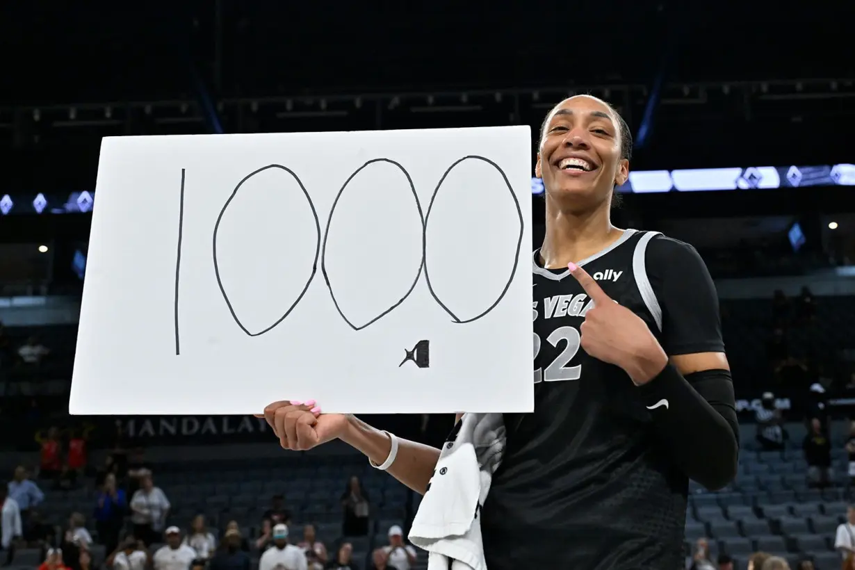 A'ja Wilson #22 of the Las Vegas Aces celebrates after becoming the first WNBA player to score 1,000 points in a single season during the game against the Connecticut Sun on September 15, 2024 at Michelob ULTRA Arena in Las Vegas, Nevada.