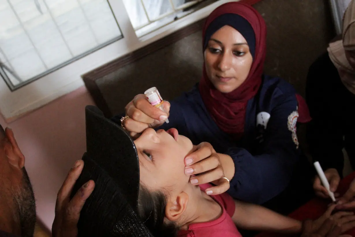 Palestinian children are vaccinated against polio, in Jabalia