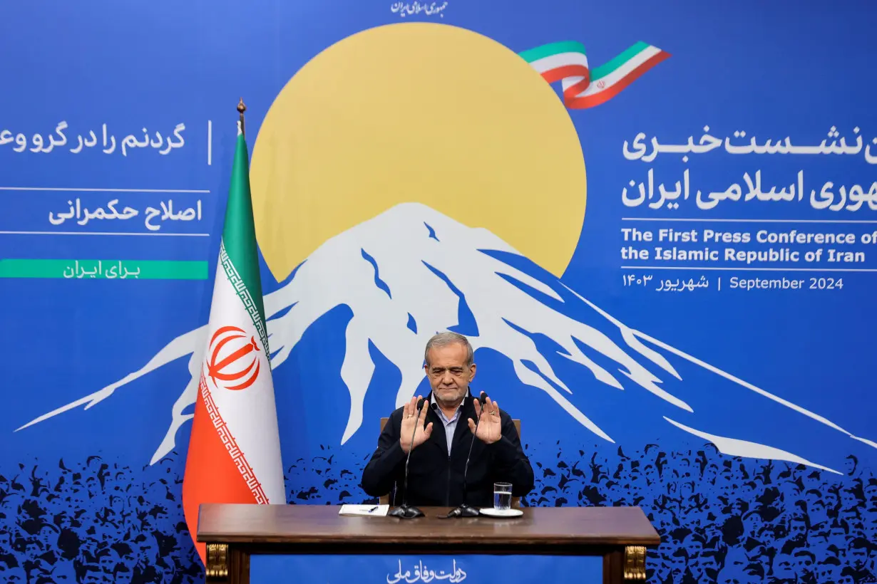 Iran's President Masoud Pezeshkian attends a press conference in Tehran