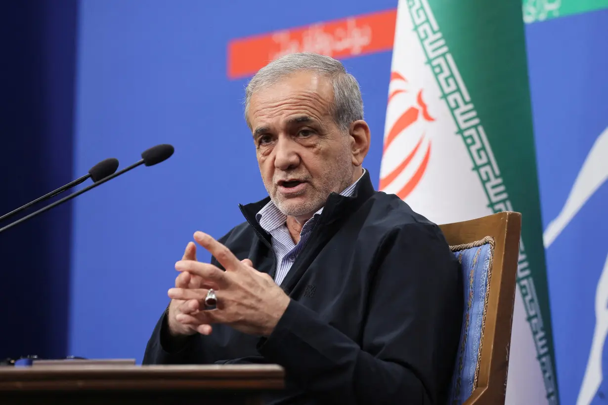 Iran's President Masoud Pezeshkian attends a press conference in Tehran