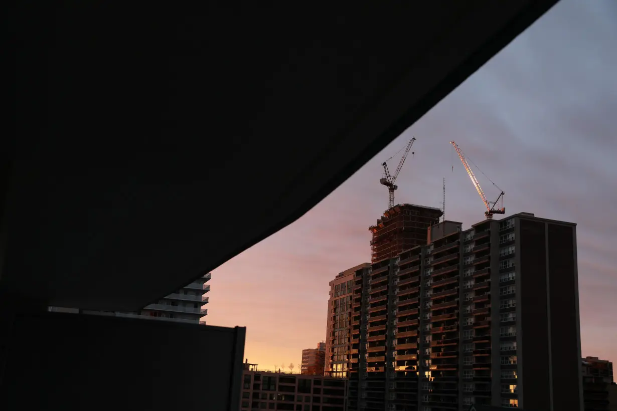 An apartment building is lit by the dawn sun in Toronto