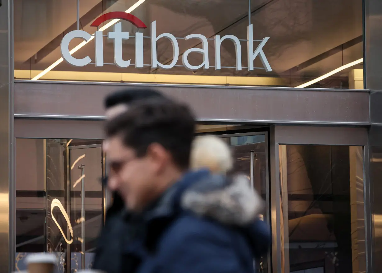 Workers exit the Citi Headquarters in New York