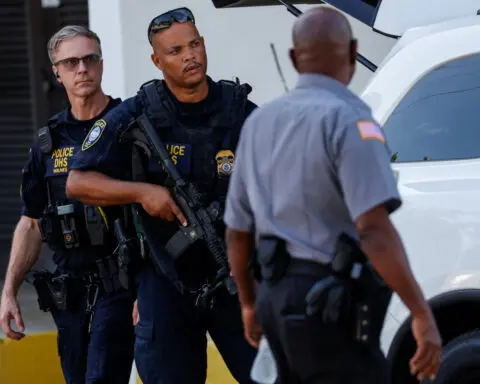Suspect in Trump apparent assassination attempt hit with gun charges, media report
