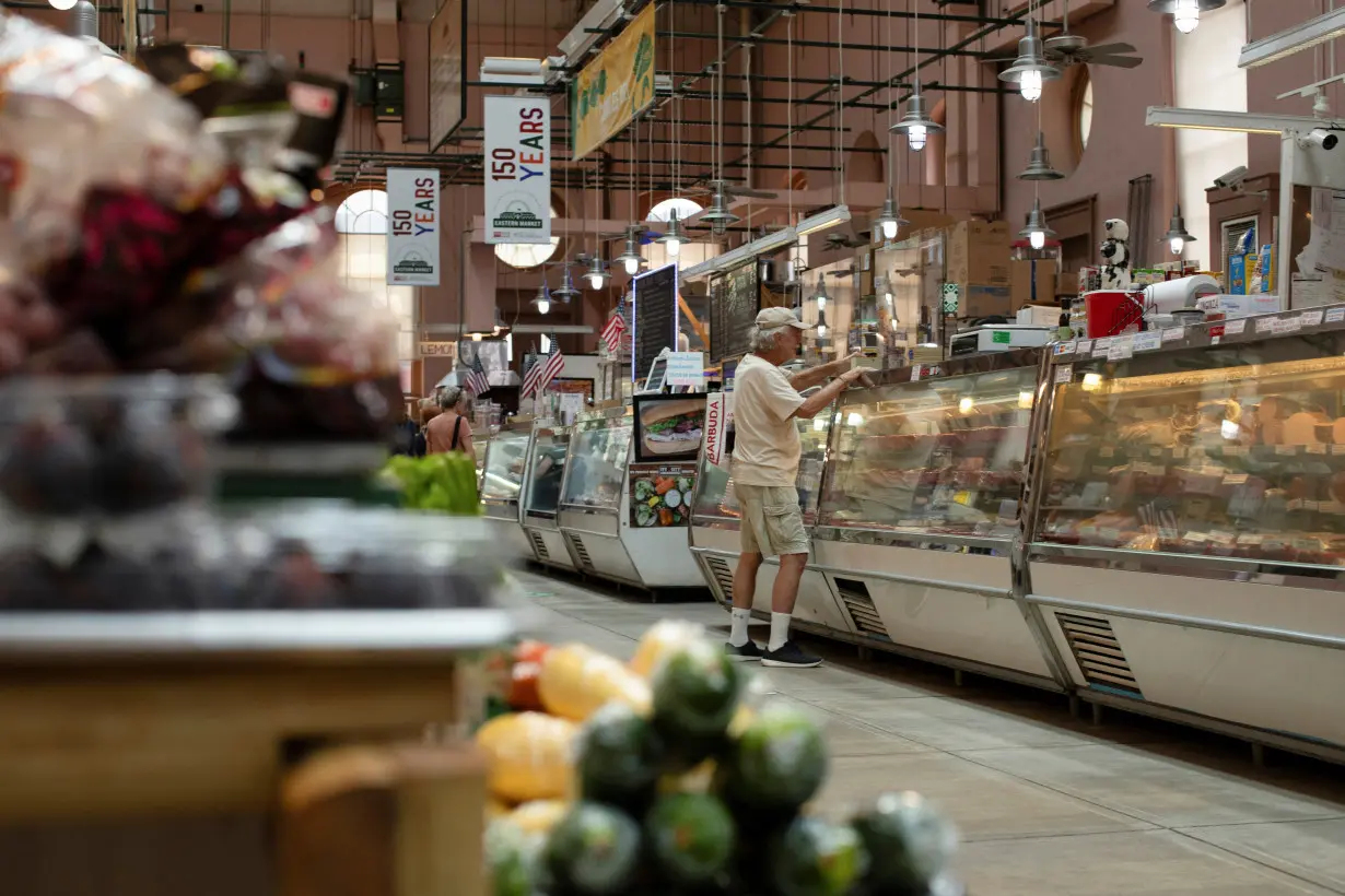 People shop for groceries at Eastern Market in Washington